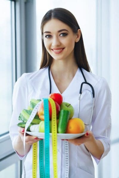 health-beauty-serious-doctor-writes-plane-diet-woman-sits-office-young-doctor-with-beautiful-smile-fresh-fruit_118454-3597.jpg